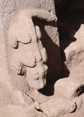 A photograph of a stone carving of an animal-like figure at Gobekli Tepe, a mysterious and ancient site in Turkey.